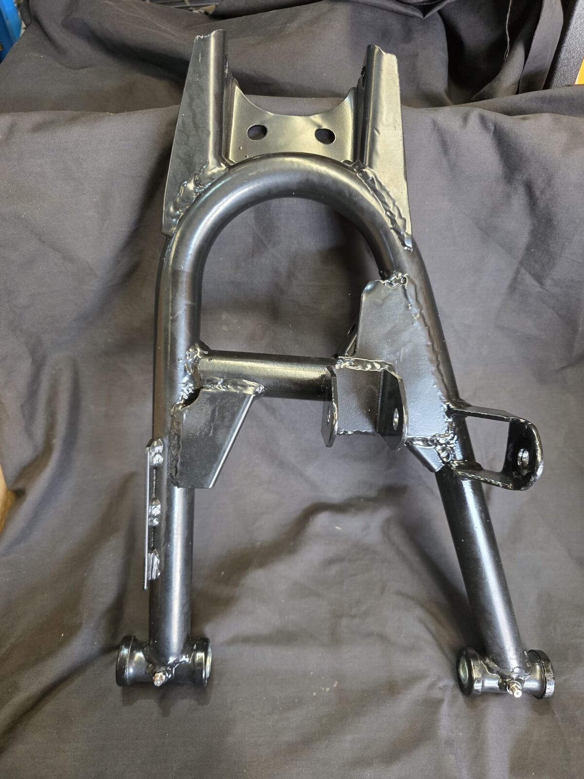 Lower A-Arm Welding, Rear, L E10 / E10 CRew / E10 Cargo